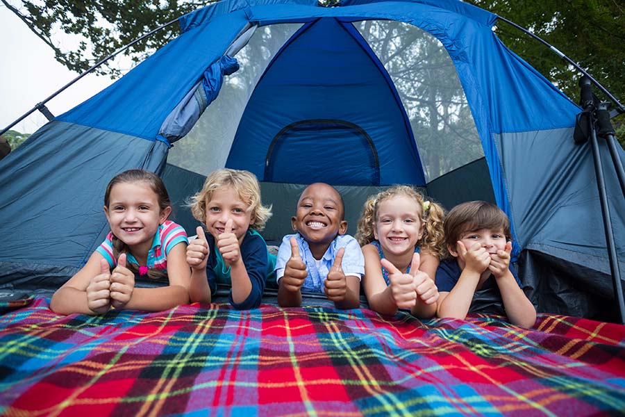 Happy Siblings On A Camping Trip