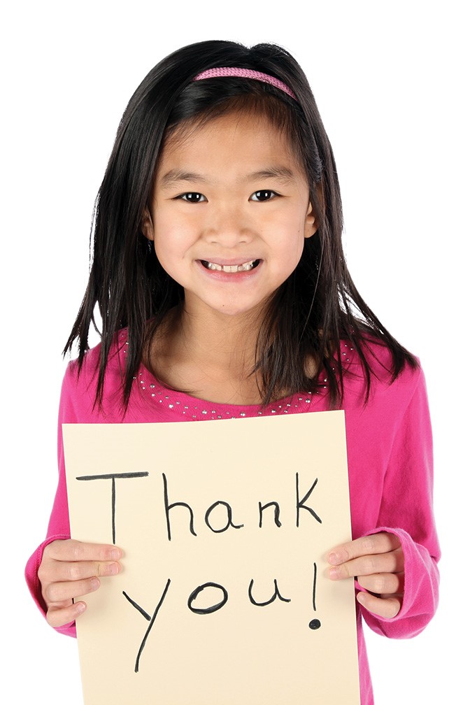 Girl Holding Thank You Sign