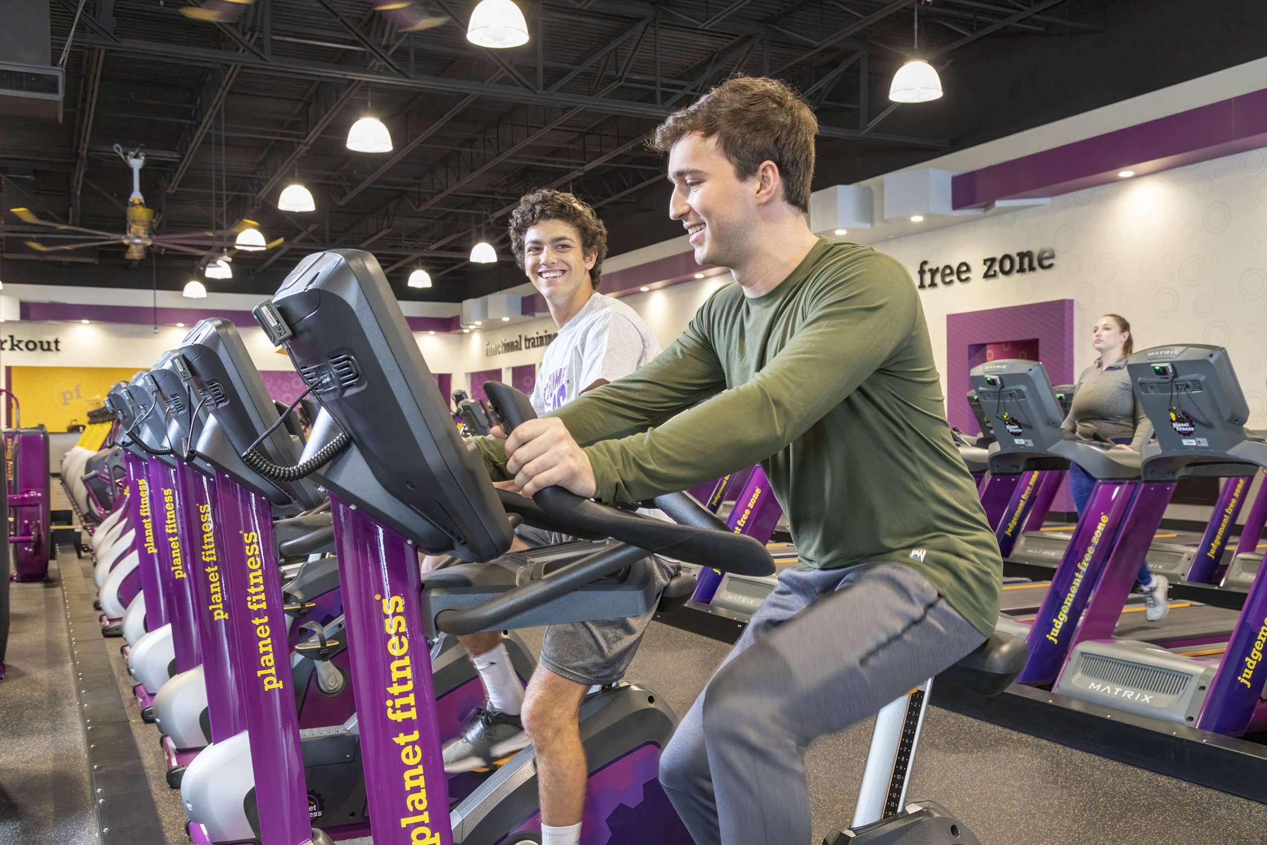 Teens Using Exercise Bikes At Planet Fitness