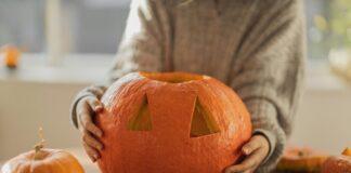 Person carving a pumpkin