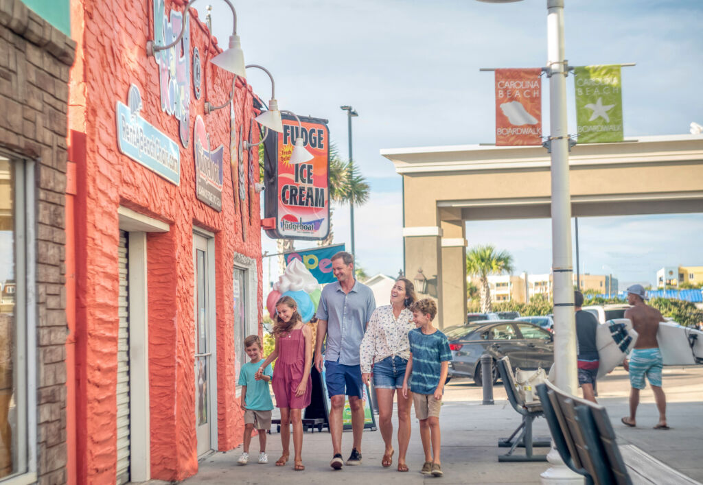 Family walking down a boardwalk