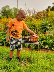 Child with a model train