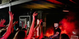 Kids dancing in front of a DJ