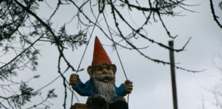 Garden gnome on a swing