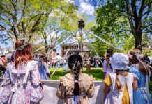 People surrounding a maypole at Dover Days