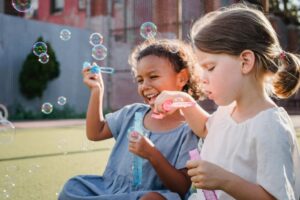 Kids blowing bubbles