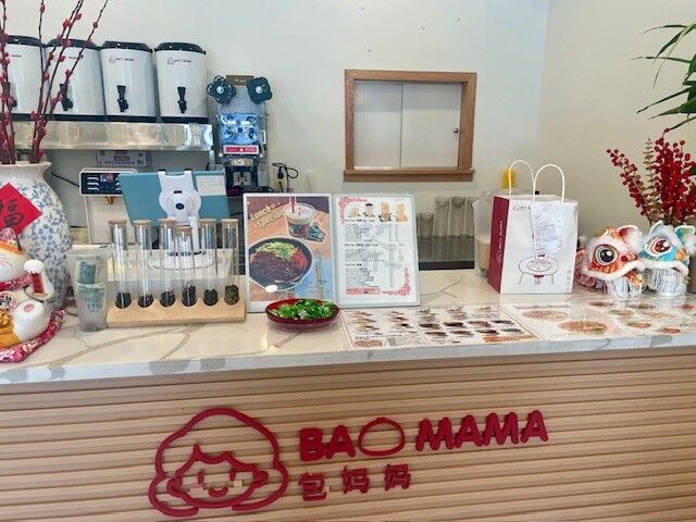 Counter full of goodies at Bao Mama in Cherry Hill, New Jersey, which has Chinese bao buns, dumplings, bubble waffles and more