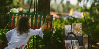 An artist painting outside