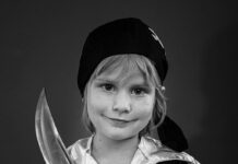 Young girl in pirate costume