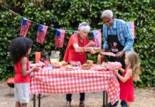 Fun in the Delaware Valley This Independence Day Weekend: July 4-5 Kids being served food at a Fourth of July barbecue by an elderly man and woman