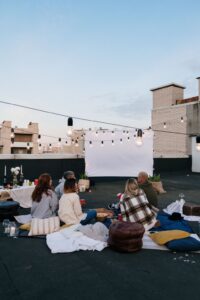 People watching a movie outside