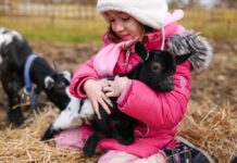 Weekend Fun in the Delaware Valley: July 17-19 A girl holding a baby goat at a petting zoo
